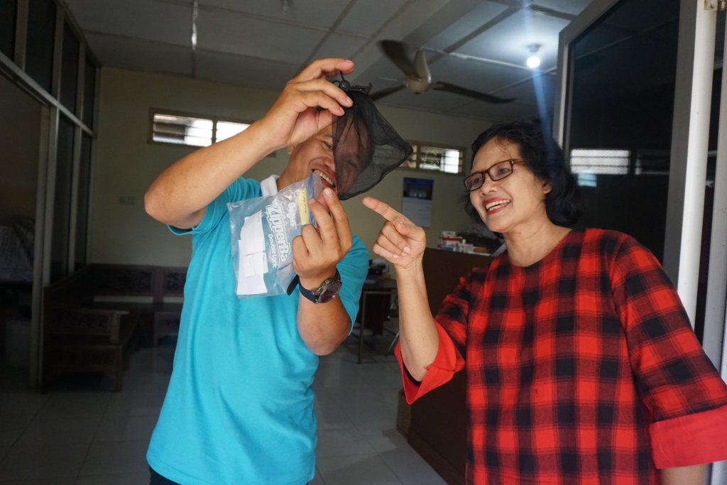  Adi Utarini, the senior researcher (right), checks a sample collected from the community Pic courtesy, WMP Yogyakarta