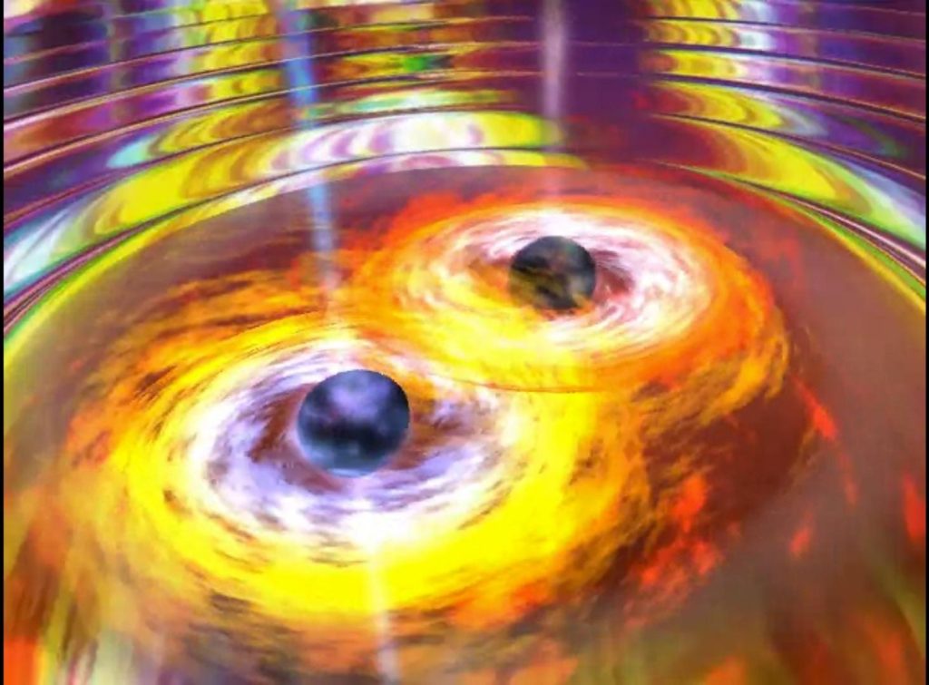 Two spiralling supermassive black holes eventually merge, throwing off huge gravitational waves.