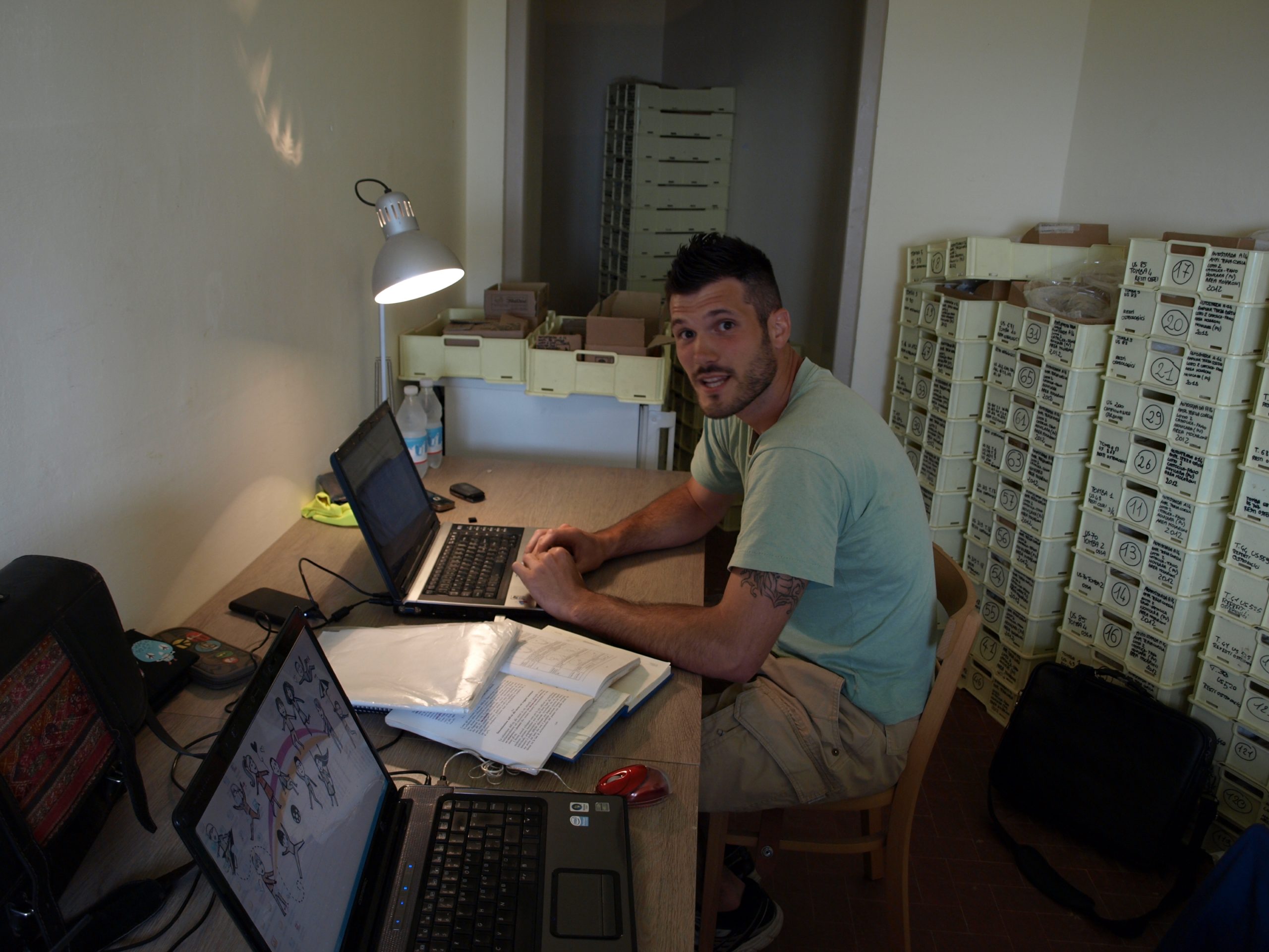 Michael A. Beck De Lotto completing the anthropological field-recording forms during the excavation of the Novilara necropolis. Courtesy of the Novilara research team.