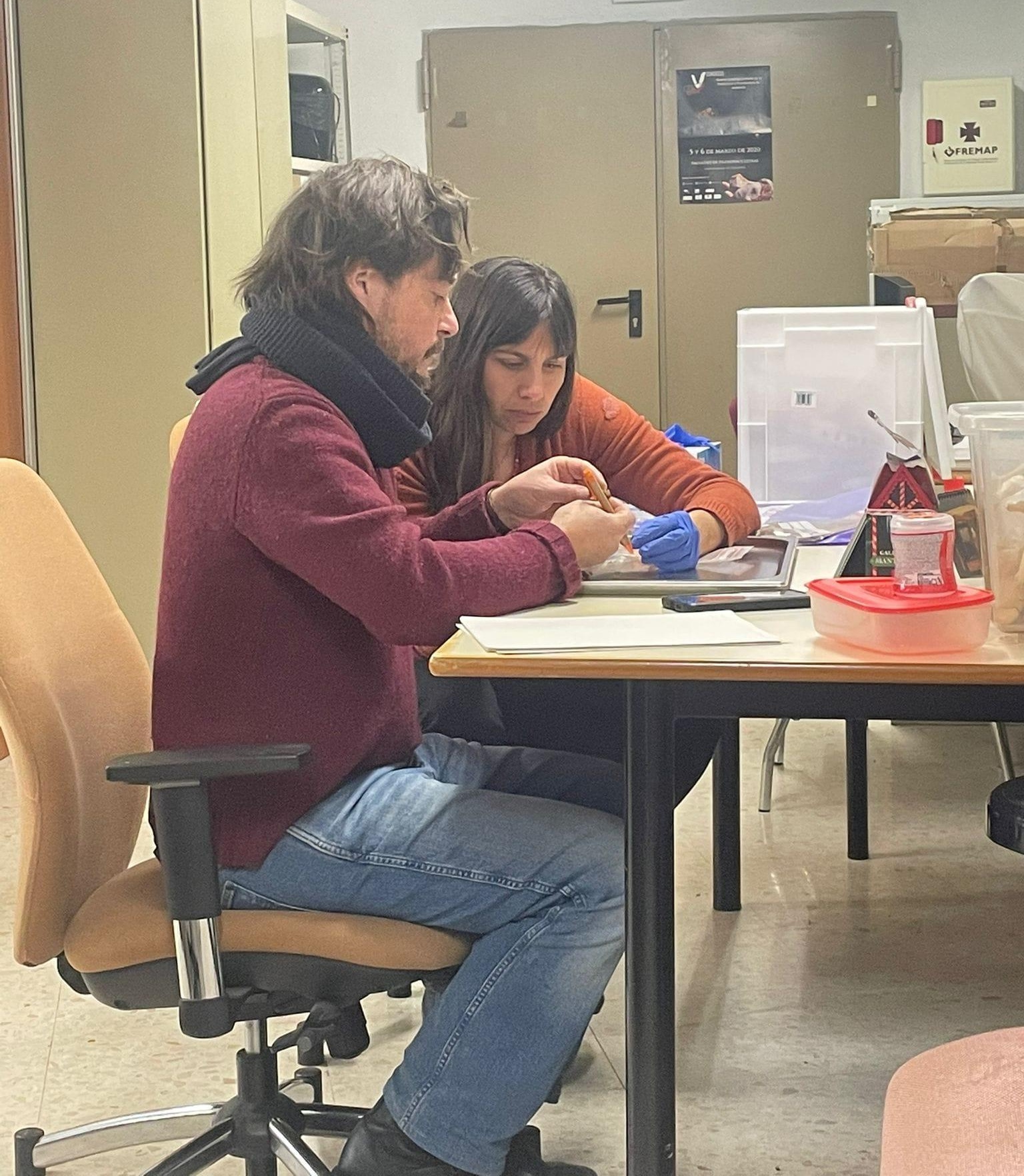 Zita Laffranchi and Marco Milella studying human skeletal remains in the laboratory. Courtesy of the Novilara research team.
