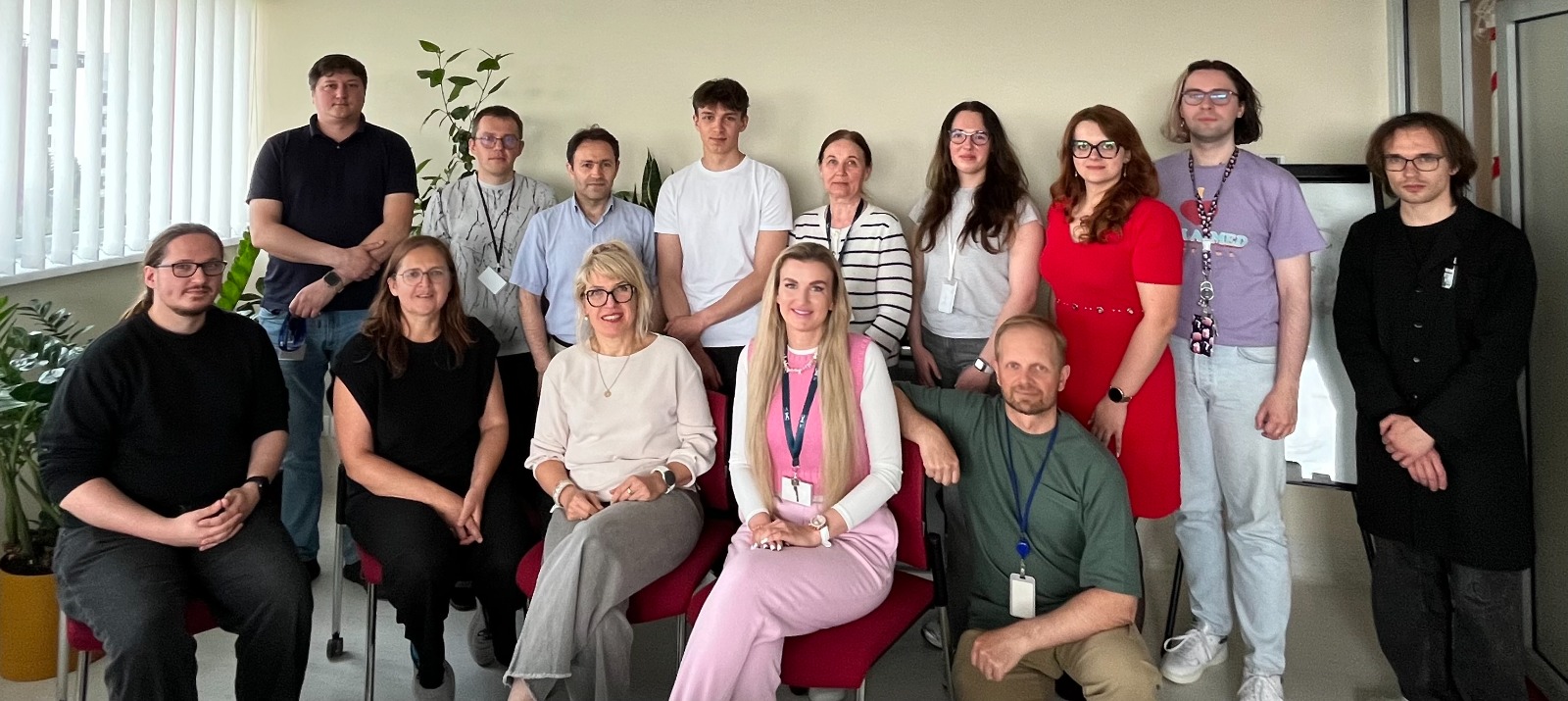 Thirteen members of the Regenerative Medicine Department gathered for a group portrait in a bright office